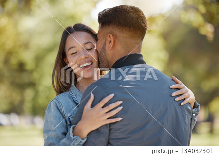 Couple, outdoor and kiss on cheek with a smile for love, care and happiness together in summer. Young man and woman at nature park for affection or hug on happy and romantic date or vacation to relax Couple, outdoor and kiss on cheek with a smile for love, care and happiness together in summer. Young man and woman at nature park for affection or hug on happy and romantic date or vacation to relax 134032301