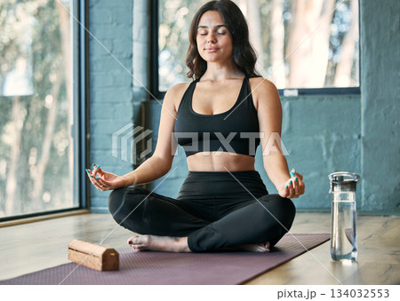 Yoga, lotus meditation and woman in gym for health, wellness and mindfulness exercise. Pilates, zen chakra and calm female yogi meditate for spiritual training, holistic workout or peace with incense 134032553