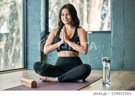 Namaste, yoga and portrait smile of woman in gym for health, wellness and exercise. Pilates, meditation and happy female yogi with prayer hands for training, exercising and meditate with incense. 134032562