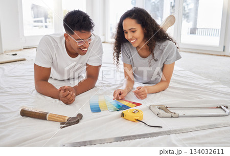 Paint, renovation and choice with a couple in their new home together for a remodeling project. Construction, real estate or property improvement with a man and woman looking at a color pallet Paint, renovation and choice with a couple in their new home together for a remodeling project. Construction, real estate or property improvement with a man and woman looking at a color pallet 134032611