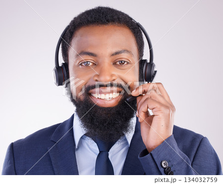 Call center, customer service and portrait of black man, studio and consulting questions on microphone. Happy male model, telemarketing consultant and contact of telecom sales, smile and crm advisor Call center, customer service and portrait of black man, studio and consulting questions on microphone. Happy male model, telemarketing consultant and contact of telecom sales, smile and crm advisor 134032759