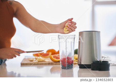 Fruit, smoothie and morning with hands of woman in kitchen for gut health, diet and breakfast. Wellness, detox and nutrition with closeup of female person at home for cooking, juice and weight loss 134032803