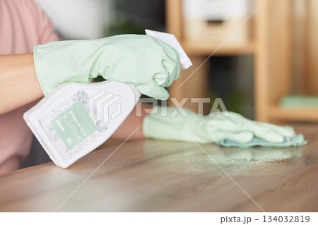 Woman, hands and cleaning table in housekeeping for bacteria or germ removal at home. Hand of female cleaner wiping surface with spray bottle and cloth for clean hygiene and furniture disinfection 134032819