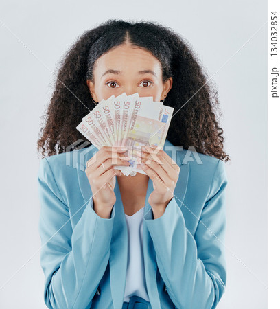 Portrait, eyes and cash with a business woman in studio on a gray background making a perfect hand gesture. Wow, finance and money with a surprised female employee holding euro bills for investment Portrait, eyes and cash with a business woman in studio on a gray background making a perfect hand gesture. Wow, finance and money with a surprised female employee holding euro bills for investment 134032854