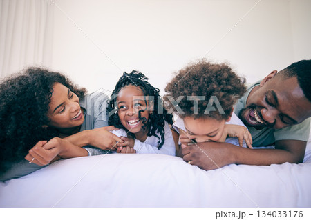 Laugh, relax and morning with black family in bedroom for wake up, bonding and affectionate. Weekend, smile and care with parents and children at home for playful, funny and free time together Laugh, relax and morning with black family in bedroom for wake up, bonding and affectionate. Weekend, smile and care with parents and children at home for playful, funny and free time together 134033176