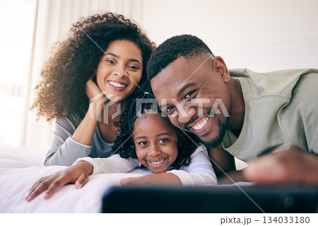 Selfie, smile and black family relax in bed, happy and bonding while posing in their home. Love, girl and parents in a bedroom, resting and having fun, joy and cheerful for photo or profile picture Selfie, smile and black family relax in bed, happy and bonding while posing in their home. Love, girl and parents in a bedroom, resting and having fun, joy and cheerful for photo or profile picture 134033180