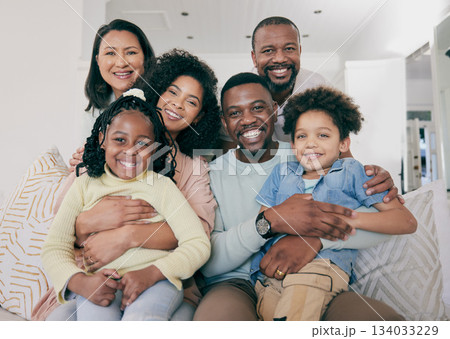Black family, smile and portrait on couch with children, parents and grandparents with happiness, love and care. Senior man, women and kids with generations, hug and bonding in living room on sofa 134033229