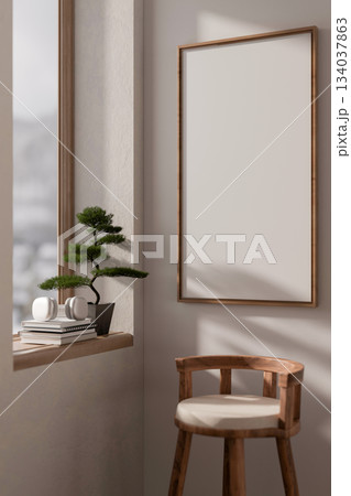 Blank wooden frame hanging vertically on wall over a stool chair near window with books and bonsai. Blank wooden frame hanging vertically on wall over a stool chair near window with books and bonsai. 134037863