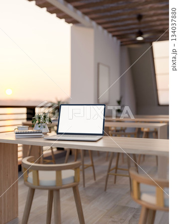 White screen laptop with books and coffee cup on wooden counter table long table on the terrace. 134037880