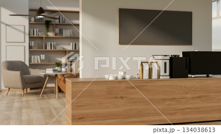 Wooden counter bar with coffee making machine in front of white wall at the entrance of living room 134038613