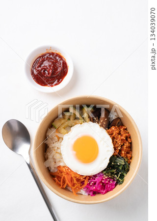 Bibimbap, Korean food, Cooked rice with vegetables, pork and egg in biodegrable bowl 134039070