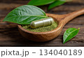 Alternative medicine herbal organic capsule, mineral, drug with herb leaf. 134040189