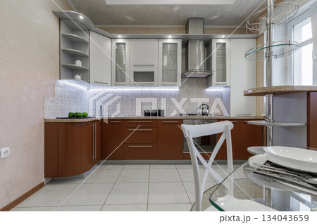 Modern Kitchen Interior with Cabinets, Countertop and Gas Stove Modern Kitchen Interior with Cabinets, Countertop and Gas Stove 134043659