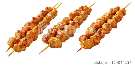 Grilled chicken Satay skewer with a golden brown glaze, isolated on white background, concept of tasty street food Grilled chicken Satay skewer with a golden brown glaze, isolated on white background, concept of tasty street food 134044154