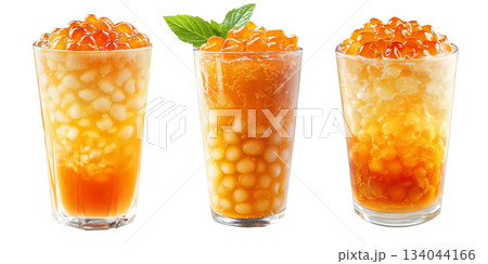 Orange bubble tea Filipino Sagot Gulaman filled with tapioca pearls and topped with mint, isolated on white background. 134044166