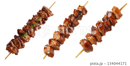 Grilled chicken yakitori skewer with teriyaki glaze or Isaw Filipino street food isolated on white transparent background 134044171