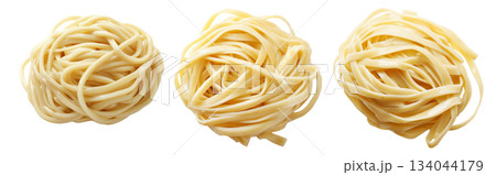 Raw fettuccine pasta nest or Japanese udon isolated on white transparent background, representing cooking ingredients 134044179
