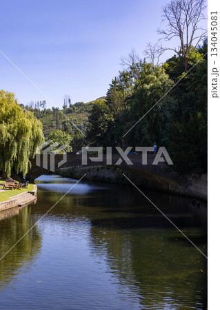 Esch-sur-Sure, Wiltz, Grand-Duche de Luxembourg, September 07, 2025, Peaceful pathway beside curved Esch-sur-Sure, Wiltz, Grand-Duche de Luxembourg, September 07, 2025, Peaceful pathway beside curved 134045081