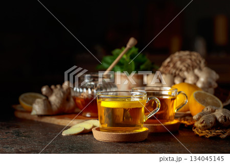 Ginger tea with lemon, honey, mint, and ginger root. Ginger tea with lemon, honey, mint, and ginger root. 134045145