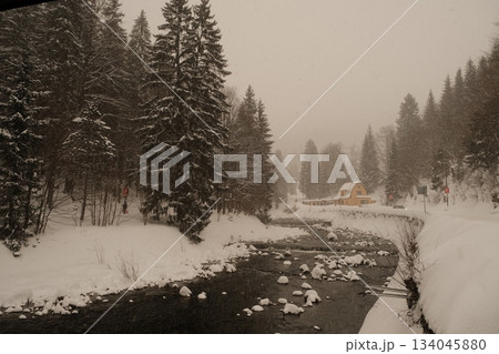 Winter Stream Beside Snowy Forest Cabin Winter Stream Beside Snowy Forest Cabin 134045880
