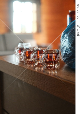 Amber Liquid Bottles Displayed On Shelf 134046200
