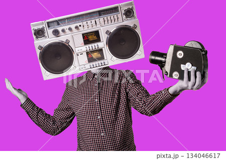 Abstract modern collage. The man with the head of a tape recorder takes himself off to an old movie camera. Selffi concept 134046617