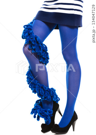 Woman long legs and blue stockings isolated 134047129