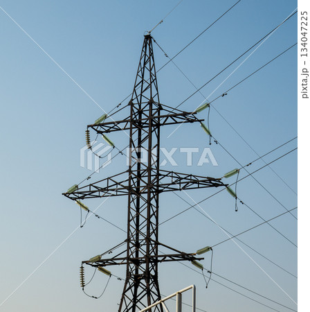 A tall power tower with many wires coming out of it 134047225