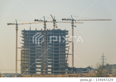 Yerevan Armenia 10.25.2025. A large building under construction with cranes in the background Yerevan Armenia 10.25.2025. A large building under construction with cranes in the background 134047229