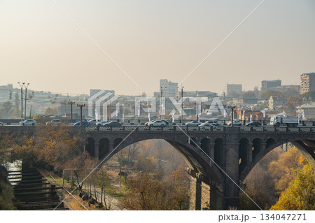 Yerevan Armenia 10.25.2025. A bridge Pobeda over a river with a city in the background Yerevan Armenia 10.25.2025. A bridge Pobeda over a river with a city in the background 134047271