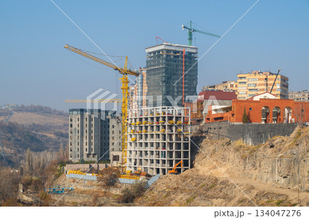 Yerevan Armenia 10.25.2025. A construction site with a large building in the background Yerevan Armenia 10.25.2025. A construction site with a large building in the background 134047276