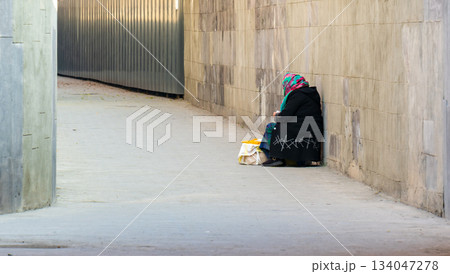Yerevan Armenia 10.25.2025. An old woman is sitting and selling candles for the church Yerevan Armenia 10.25.2025. An old woman is sitting and selling candles for the church 134047278