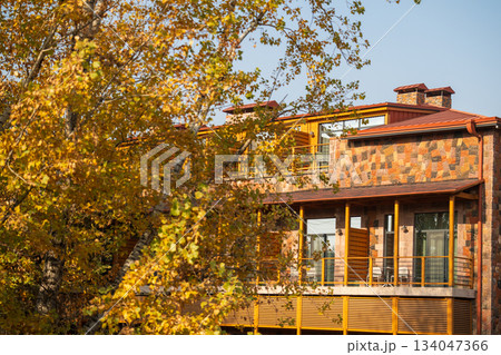 Yerevan Armenia 10.25.2025. A house with a balcony and a tree in front of it 134047366