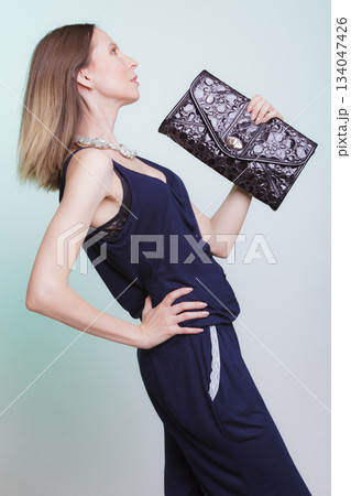 Elegant fashion woman with leather handbag Elegant fashion woman with leather handbag 134047426