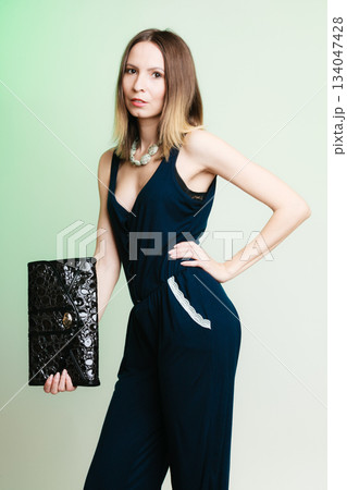 stylish woman fashion girl holding black handbag stylish woman fashion girl holding black handbag 134047428