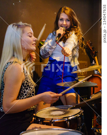 Woman singing, band playing instruments. 134047638