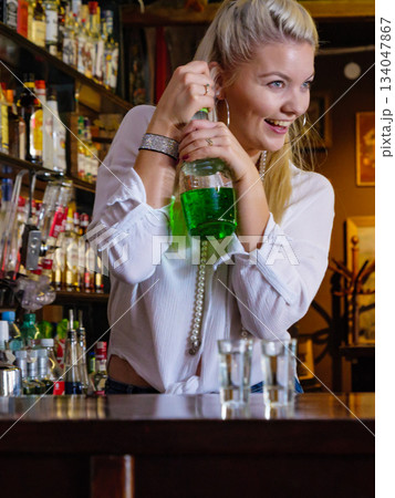 Woman working at the bar counter Woman working at the bar counter 134047867