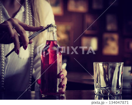 Woman working at the bar counter Woman working at the bar counter 134047871