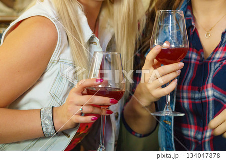 Girls with alcohol glass in pub club Girls with alcohol glass in pub club 134047878