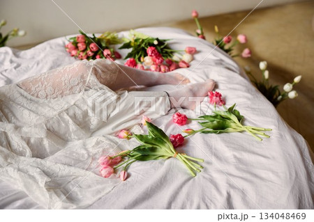 Decorative tulips on bedding, Carefully crafted scene of tulips on bed with linens for social media post 134048469