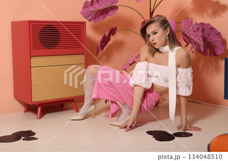 Graceful portrait showcasing fashionable attire and classic decor Graceful portrait showcasing fashionable attire and classic decor 134048510