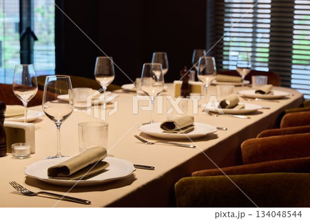 elegant outdoor dining, sophisticated brunch table setup, bright patio arrangement with refined tableware elegant outdoor dining, sophisticated brunch table setup, bright patio arrangement with refined tableware 134048544