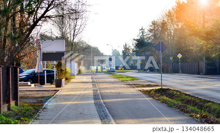 Quiet street in a residential area in the suburbs. Sidewalk and bike path. Quiet street in a residential area in the suburbs. Sidewalk and bike path. 134048665