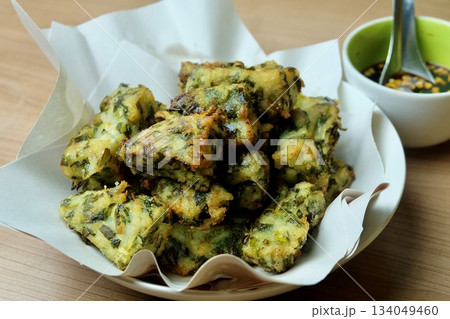 Homemade Fried Thai Chive Cakes and Dipping Sauce Homemade Fried Thai Chive Cakes and Dipping Sauce 134049460