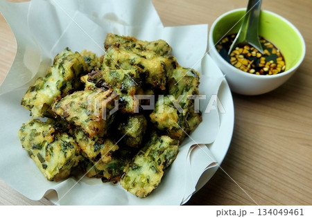 Thai Fried Chive Cakes with Dipping Sauce Thai Fried Chive Cakes with Dipping Sauce 134049461