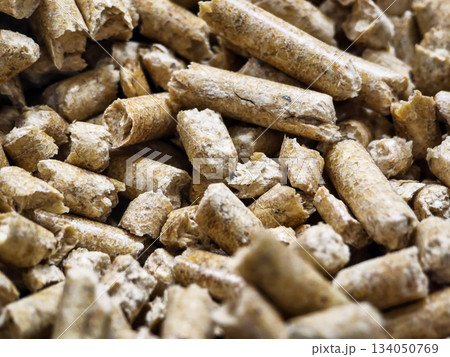 Wood pellets made from sawdust stored in a pile for heating and cooking purposes Wood pellets made from sawdust stored in a pile for heating and cooking purposes 134050769