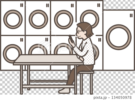 Illustration of a woman in her 40s looking at her smartphone while using a coin laundry Illustration of a woman in her 40s looking at her smartphone while using a coin laundry 134050978