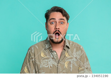 Adult man raising eyebrows opening mouth widening eyes in sudden surprise shock with extreme emotion Adult man raising eyebrows opening mouth widening eyes in sudden surprise shock with extreme emotion 134051190