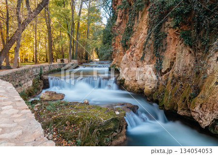 Monasterio de Piedra river cascades flowing through autumn landscape 134054053