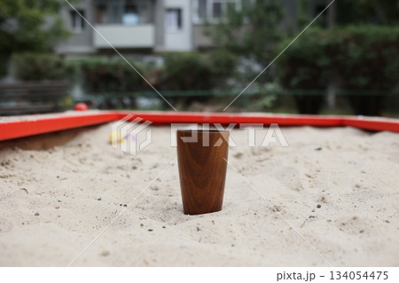 Elegant handmade wood water glass or wooden cup isolated on white background. 134054475